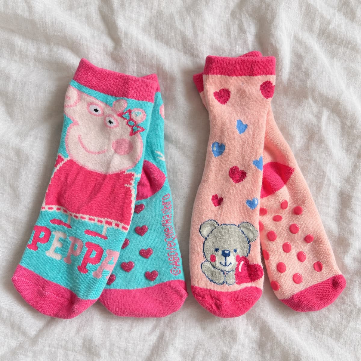 Peppa and teddy anti-slip socks, two pairs on cream linen